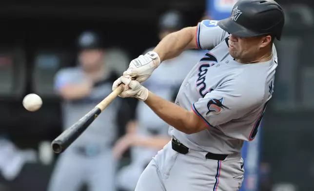 Miami Marlins' Jakob Marsee hits a three run home run off Cleveland Guardians starting pitcher Gavin Williams during the first inning of a baseball game, Wednesday, Aug. 13, 2025, in Cleveland. (AP Photo/David Dermer)