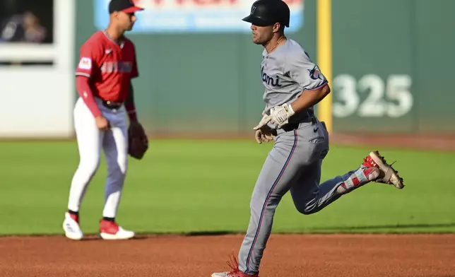 Miami Marlins' Jakob Marsee runs the bases after hitting a three-run home run off Cleveland Guardians starting pitcher Gavin Williams during the first inning of a baseball game, Wednesday, Aug. 13, 2025, in Cleveland. (AP Photo/David Dermer)