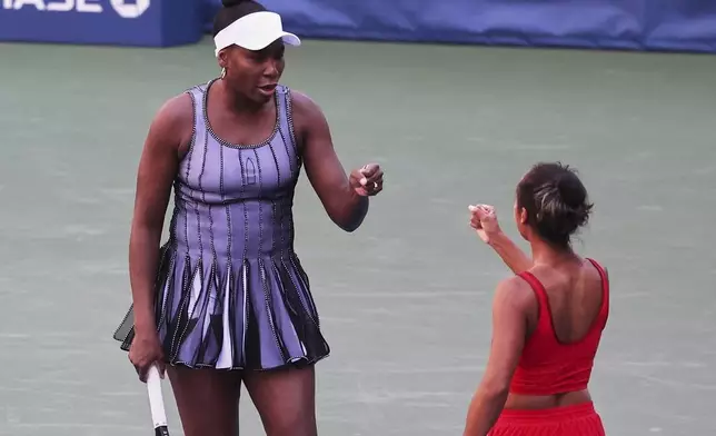Venus Williams, of the United States, celebrates with her doubles partner Leylah Fernandez, of Canada, during the third round of the U.S. Open tennis championships, Saturday, Aug. 30, 2025, in New York. (AP Photo/Heather Khalifa)