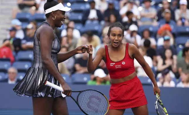 Venus Williams, of the United States, celebrates with doubles partner Leylah Fernandez, of Canada, during the U.S. Open tennis championships, Saturday, Aug. 30, 2025, in New York. (AP Photo/Heather Khalifa)