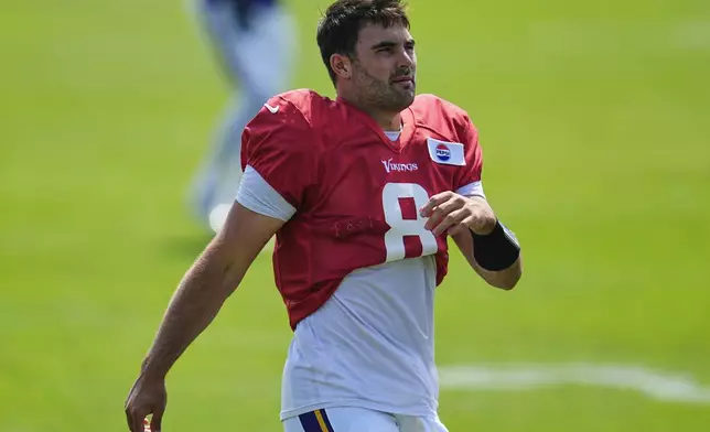 Minnesota Vikings quarterback Sam Howell (8) takes part in drills during a joint NFL football training camp with the New England Patriots, Wednesday, Aug. 13, 2025, in Eagan, Minn. (AP Photo/Abbie Parr)