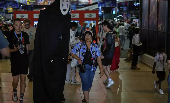 People attend the Comic Con Festival in Johannesburg, South Africa, Saturday, Aug. 30, 2025. (AP Photo/Themba Hadebe)