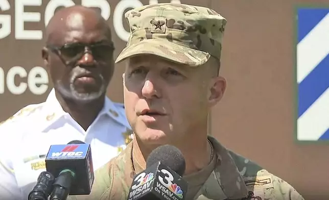 In this image taken from video, Brig Gen. John Lubas speaks during a news conference about the shooting that occurred earlier in the day at the Fort Stewart Army post at Fort Stewart, Ga., Wednesday, Aug. 6, 2025. (WJCL via AP)
