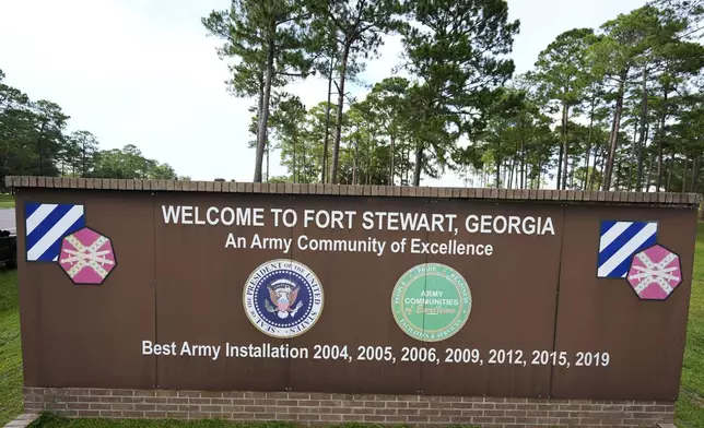 A sign welcoming people to Fort Stewart in Georgia is seen on Wednesday, Aug. 6, 2025. (AP Photo/Mike Stewart)