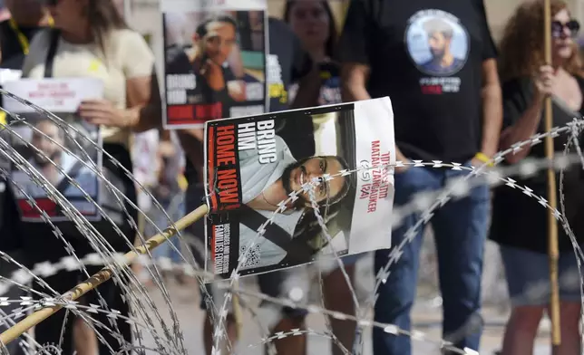 Families of hostages protest, demanding the release from Hamas captivity in the Gaza Strip, at the plaza known as the hostages square in Tel Aviv, Israel, Saturday, Aug. 2, 2025. (AP Photo/Ariel Schalit)