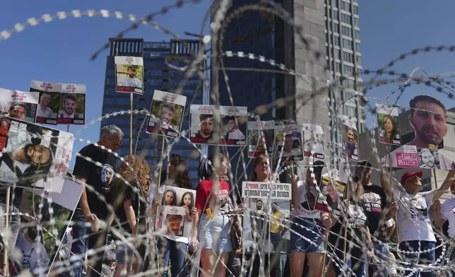 Families of hostages protest, demanding the release from Hamas captivity in the Gaza Strip, at the plaza known as the hostages square in Tel Aviv, Israel, Saturday, Aug. 2, 2025. (AP Photo/Ariel Schalit)