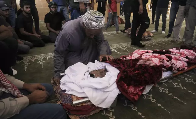 Mourners attend the funeral of Palestinian activist Awdah Al Hathaleen, who was killed by Israeli settler according to Palestinian health officials, in the West Bank Bedouin village of Umm al-Khair, Thursday, Aug. 7, 2025. (AP Photo/Mahmoud Illean)