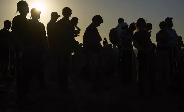 Israeli right-wing activists attend a rally calling for the re-establishment of Jewish settlements in the Gaza Strip, near the border in southern Israel, Wednesday, July 30, 2025. (AP Photo/Ohad Zwigenberg)