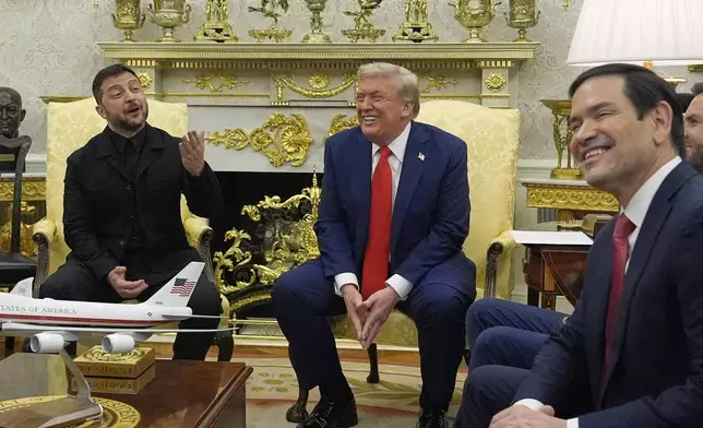 President Donald Trump meets with Ukraine's President Volodymyr Zelenskyy in the Oval Office at the White House, Monday, Aug. 18, 2025, in Washington, as Secretary of State Marco Rubio smiles at right. (AP Photo/Julia Demaree Nikhinson)