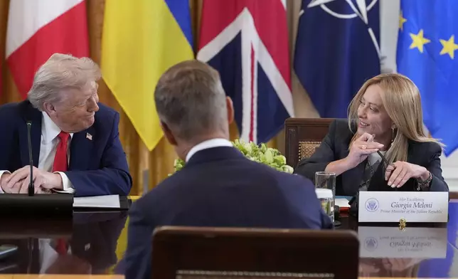 President Donald Trump, left, and Italy's Prime Minister Giorgia Meloni participate in a meeting with and Ukrainian President Volodymyr Zelenskyy in the East Room of the White House, Monday, Aug. 18, 2025, in Washington. (AP Photo/Alex Brandon)