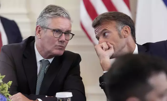 British Prime Minister Keir Starmer, left, and France's President Emmanuel Macron participate in a meeting with President Donald Trump and Ukrainian President Volodymyr Zelenskyy in the East Room of the White House, Monday, Aug. 18, 2025, in Washington. (AP Photo/Alex Brandon)