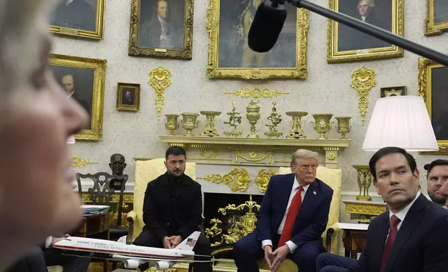 President Donald Trump meets with Ukraine's President Volodymyr Zelenskyy in the Oval Office at the White House, Monday, Aug. 18, 2025, in Washington, as White House chief of staff Susie Wiles, left, and Secretary of State Marco Rubio listen. (AP Photo/Julia Demaree Nikhinson)