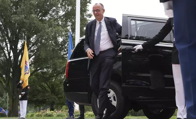 Germany's Chancellor Friedrich Merz arrives to meet with President Donald Trump and Ukraine's President Volodymyr Zelenskyy, Monday, Aug. 18, 2025, at the South Portico of the White House in Washington. (AP Photo/Jacquelyn Martin)