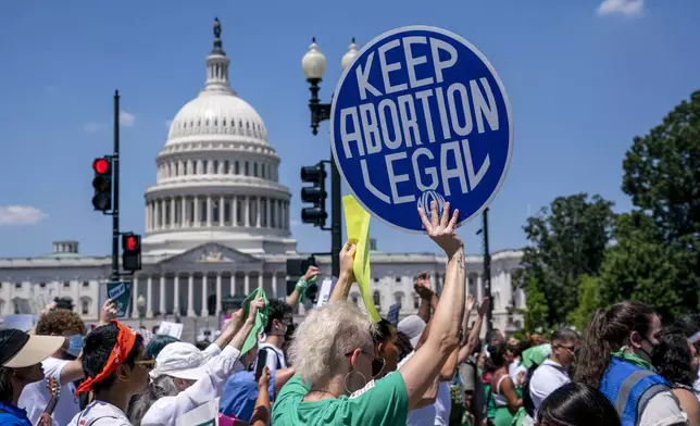 FILE - Abortion-rights activists demonstrate against the Supreme Court decision to overturn Roe v. Wade that established a constitutional right to abortion, on Capitol Hill in Washington, June 30, 2022. (AP Photo/J. Scott Applewhite, File)