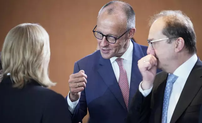 German Chancellor Friedrich Merz, center, attends a cabinet meeting at the chancellery in Berlin, Germany, Wednesday, July 30, 2025. (AP Photo/Ebrahim Noroozi)