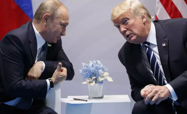 FILE - U.S. President Donald Trump meets with Russian President Vladimir Putin at the G-20 Summit on July 7, 2017, in Hamburg, Germany. (AP Photo/Evan Vucci, File)