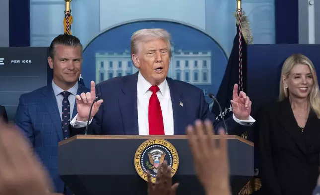FILE - President Donald Trump speaks with reporters in the James Brady Press Briefing Room at the White House, Aug. 11, 2025, in Washington, as Secretary of Defense Pete Hegseth, left, and Attorney General Pam Bondi look on. (AP Photo/Alex Brandon, File)