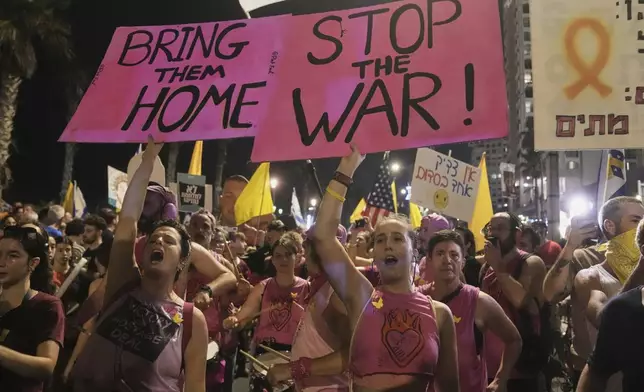 People take part in a protest outside US Embassy Branch demanding the end of the war and immediate release of hostages held by Hamas in the Gaza Strip, and against Prime Minister Benjamin Netanyahu's government in Tel Aviv, Saturday, July 26, 2025. (AP Photo/Mahmoud Illean)