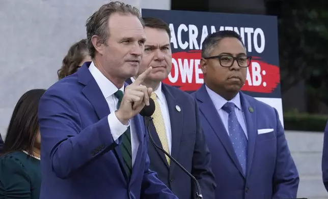 California state Assembly Republican leader James Gallagher of Yuba City, left, speaks against a package of measures to redraw the state's Congressional districts and put new maps before voters in a special election, during a news conference in Sacramento, Calif., Thursday, Aug. 21, 2025. (AP Photo/Rich Pedroncelli)