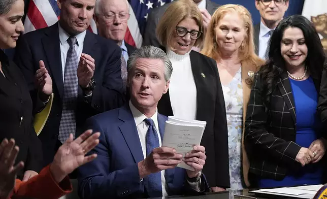 California Gov. Gavin Newsom signs legislation calling for a special election on a redrawn congressional map on Thursday, Aug. 21, 2025, in Sacramento, Calif. (AP Photo/Godofredo A. Vásquez)