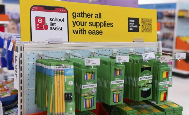 Information on a school list assist and a QR code is displayed above pencils for sale in the back-to-school supplies section of a Target in Sherwood, Ore., Friday, Aug. 8, 2025. (AP Photo/Jenny Kane)