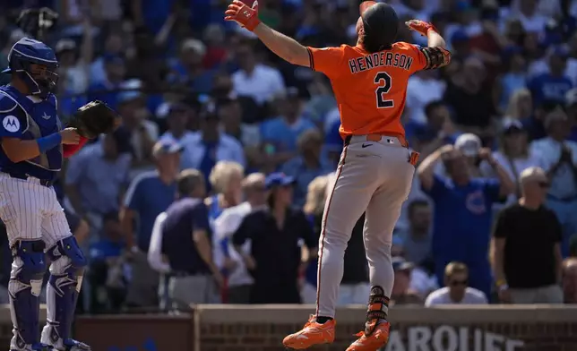Baltimore Orioles' Gunnar Henderson (2) runs the bases after hitting a three-run home run during the eighth inning of a baseball game against the Chicago Cubs, Saturday, Aug. 2, 2025, in Chicago. (AP Photo/Erin Hooley)