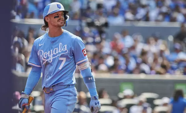 Kansas City Royals shortstop Bobby Witt Jr. (7) reacts as he heads back to the dugout after striking out against the Toronto Blue Jays during third inning MLB baseball action in Toronto, on Saturday, Aug. 2, 2025. (Sammy Kogan/The Canadian Press via AP)
