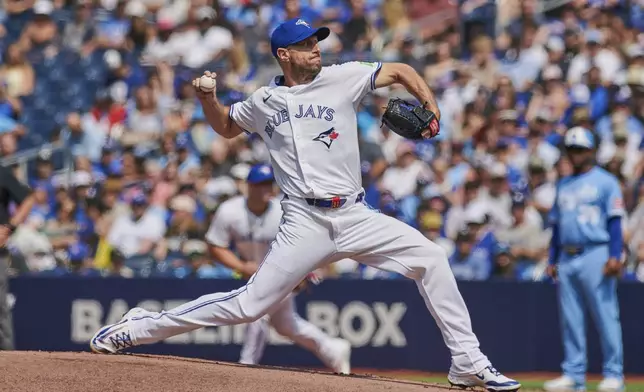 Toronto Blue Jays pitcher Max Scherzer (31) throws against the Kansas City Royals during first inning MLB baseball action in Toronto, on Saturday, Aug. 2, 2025. (Sammy Kogan/The Canadian Press via AP)