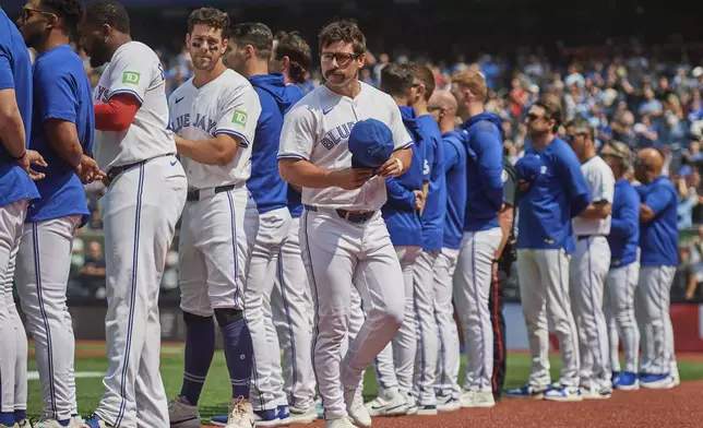 Toronto Blue Jays outfielder Davis Schneider (36) heads to the dugout ahead of MLB baseball action against the Kansas City Royals in Toronto, on Saturday, Aug. 2, 2025. (Sammy Kogan/The Canadian Press via AP)