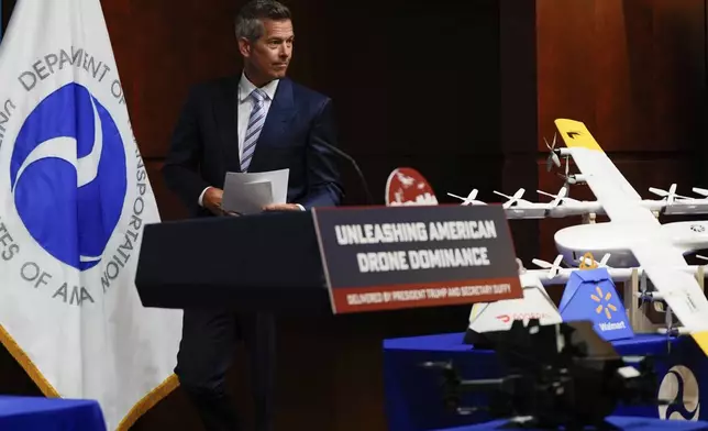 Transportation Secretary Sean Duffy arrives to speak during a news conference on new drone regulations, Tuesday, Aug. 5, 2025, at the Department of Transportation in Washington. (AP Photo/Julia Demaree Nikhinson)