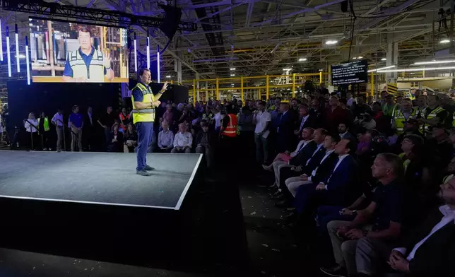Employees at the Ford Louisville Assembly Plant listen to Ford CEO Jim Farley, Monday, Aug. 11, 2025, in Louisville, Ky. (AP Photo/Darron Cummings)