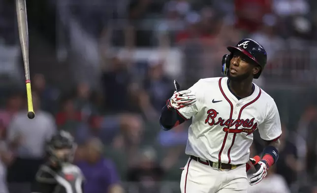 Atlanta Braves' Jurickson Profar flips his bat after hitting a two-run home run in the fourth inning of a baseball game against the Chicago White Sox, Tuesday, Aug. 19, 2025, in Atlanta. (AP Photo/Colin Hubbard)