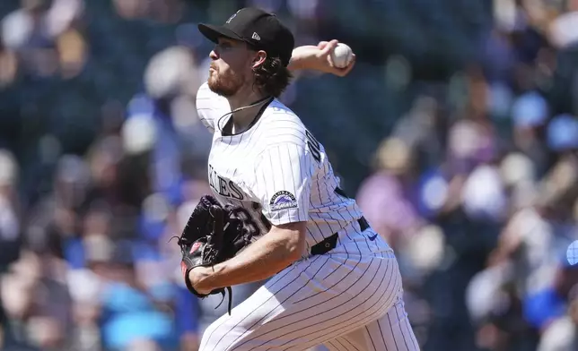 Colorado Rockies starting pitcher Chase Dollander works against the Los Angeles Dodgers in the first inning of a baseball game Thursday, Aug. 21, 2025, in Denver. (AP Photo/David Zalubowski)