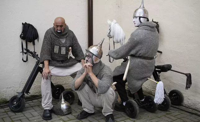 Circus performers prepare for Karandash-Fest, a street festival of circus performers in Staritsa, Russia, Aug. 2, 2025. (AP Photo/Pavel Bednyakov)