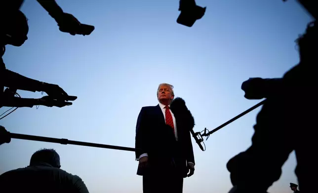 President Donald Trump speaks with reporters before boarding Air Force One at Lehigh Valley International Airport, in Allentown, Pa., Aug. 3, 2025. (AP Photo/Julia Demaree Nikhinson)
