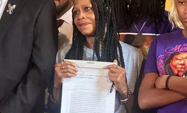 Donna Massey, mother of Sonya Massey, listens to Gov. JB Pritzker speak to reporters in the state Capitol, Tuesday, Aug. 12, 2025, in Springfield, Ili. (John O'Connor/AP)
