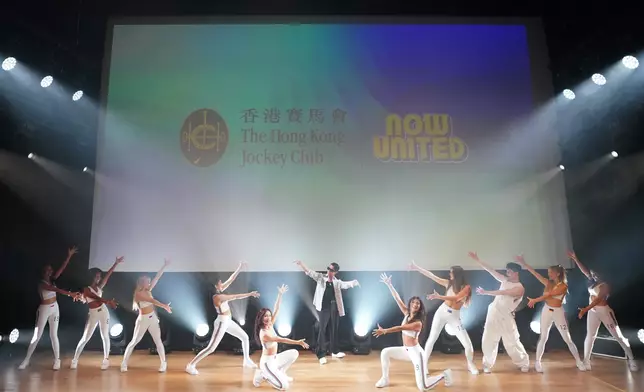 HKJC’s Rising Stars Ambassador Aaron Kwok ( centre) with Now United’s new Hong Kong, China member Ariel Tsang and other group members.