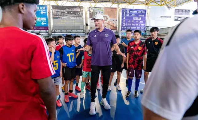 Manchester United legend Peter Schmeichel joins the Manchester United Academy U16 team and Hong Kong, China U16 Representative Team in community service, helping primary school students brush up their football skills at the Sha Tin Racecourse Sports Ground.