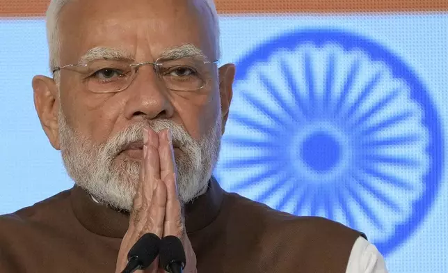 Indian Prime Minister Narendra Modi greets guests during the Japan India Economic Forum in Tokyo Friday, Aug. 29, 2025. (AP Photo/Eugene Hoshiko)