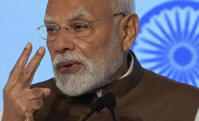 Indian Prime Minister Narendra Modi delivers a speech during the Japan India Economic Forum in Tokyo Friday, Aug. 29, 2025. (AP Photo/Eugene Hoshiko)
