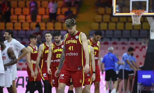 Spain's Juancho Hernangómez walks onto the court with teammates after loosing to Georgia during the EuroBasket, European Basketball Championship Group C match at the Spyros Kyprianou Arena in Limassol, Cyprus, Thursday, Aug. 28, 2025. (AP Photo/Chara Savvidou)