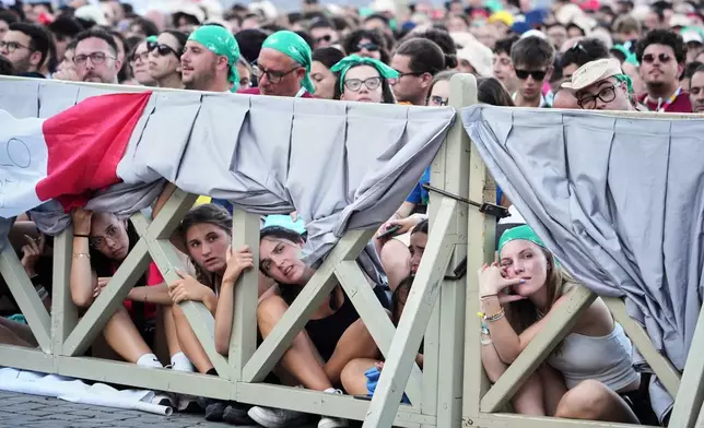 Youths attend a profession of faith moment led by Cardinal Matteo Zuppi, as part the weeklong Jubilee celebration for young Catholics, in St. Peter's Square at the Vatican, Thursday, July 31, 2025. (AP Photo/Andrew Medichini)