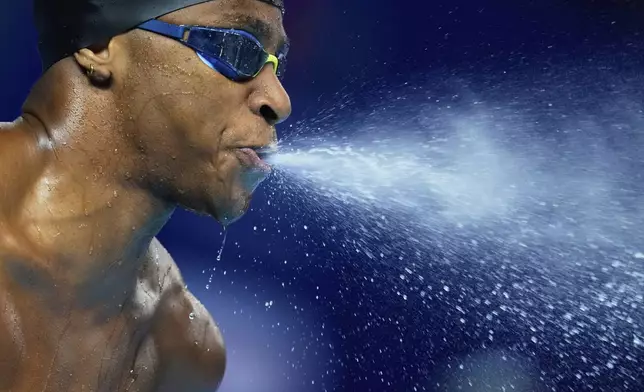 Lamar Taylor of Bahamas prepares to compete in the men's 50-meter freestyle heats at the World Aquatics Championships in Singapore, Friday, Aug.1, 2025. (AP Photo/Vincent Thian)