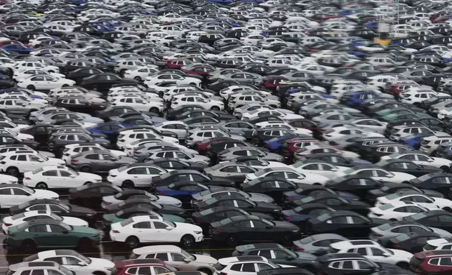 New cars are parked in a lot at the International Car Operators terminal in the Port of Zeebrugge, Belgium, Thursday, July 31, 2025. (AP Photo/Virginia Mayo)