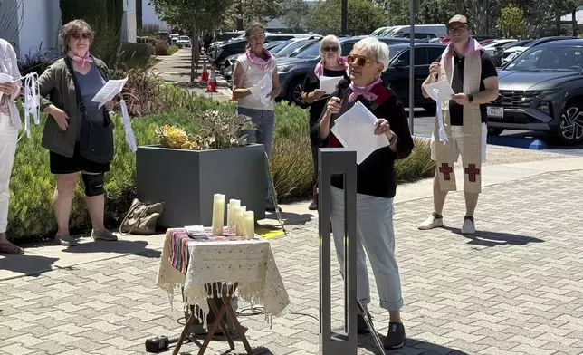 Laura Siriani, archdeacon of the Episcopal Diocese of Los Angeles, speaks at a prayer vigil for immigrants outside Santa Ana Immigration Court in Santa Ana, Calif., Thursday, July 31, 2025. (AP Photo/Deepa Bharath)
