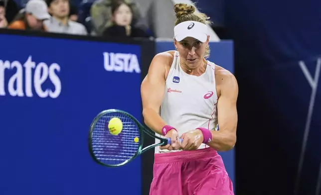 Beatriz Haddad Maia, of Brazil, returns a shot against Maria Sakkari, of Greece, during the third round of the U.S. Open tennis championships, Saturday, Aug. 30, 2025, in New York. (AP Photo/Pamela Smith)