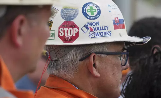 U.S. Steel's Executive V.P. and Chief Manufacturing officer Scott Bucks, right, listens as Pennsylvania Governor Josh Shapiro makes remarks during news conference at the Clairton Coke Works, a U.S. Steel plant, in Clairton, Pa., Tuesday, Aug. 12, 2025. (AP Photo/Gene J. Puskar)
