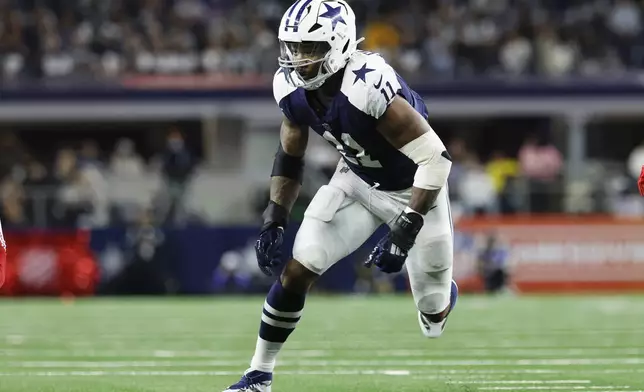 FILE - Dallas Cowboys defensive end Micah Parsons (11) rushes during an NFL football game against the New York Giants, Thursday, Nov. 28, 2024, in Arlington, Texas. (AP Photo/Matt Patterson, File)
