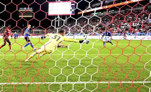 CF Montreal goalkeeper Thomas Gillier is unable to reach the game tying goal from Toronto FC's Jonathan Osorio, not seen, during second half MLS soccer action in Toronto on Saturday, August 30, 2025. (Jon Blacker/The Canadian Press via AP)