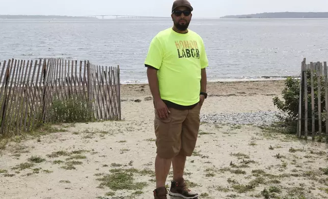 Tony Vaz, a rope access technician, stands near the beach in North Kingstown, R.I., Monday, Aug. 25, 2025, after a news conference where Democratic politicians and union members, including Vaz, called on the Trump administration to allow work to continue on the Revolution Wind offshore wind farm. (AP Photo/Jennifer McDermott)